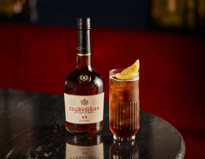 Bottle of Courvoisier next to a glass
