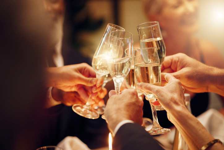people cheering with champagne